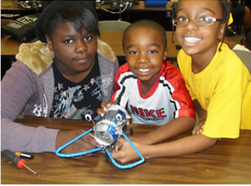 Mop Top Campers building a walking robot with soda cans!